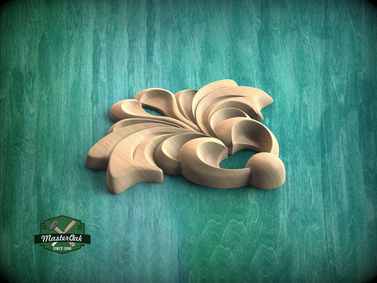 A wooden carving of a stylized flower or leaf design is displayed against a green background.