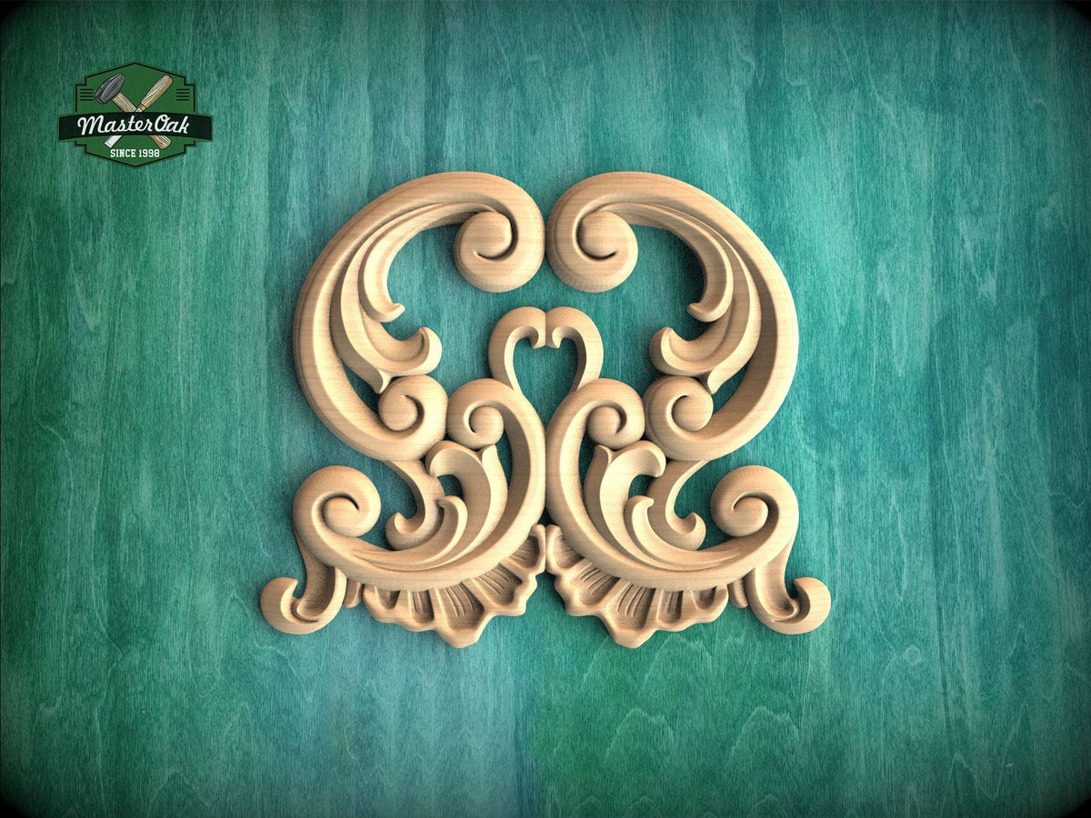 an ornate, carved wooden design with intricate scrollwork and floral elements, set against a green background.