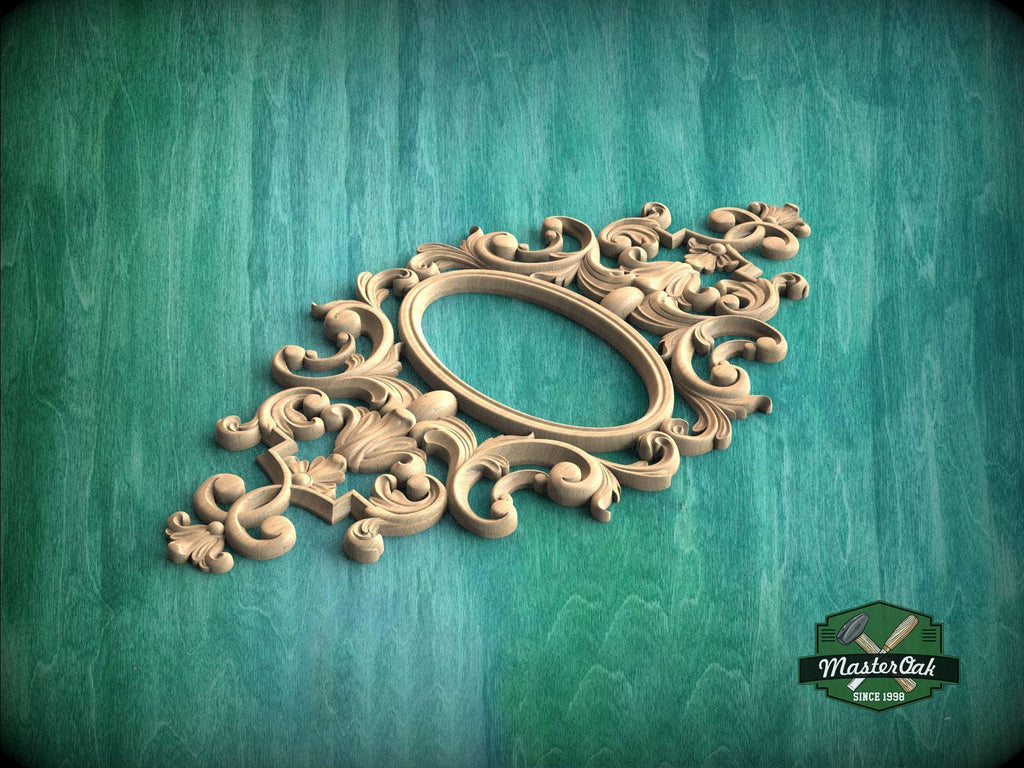 an ornate, carved wooden frame with intricate scrollwork and floral designs, set against a green background.
