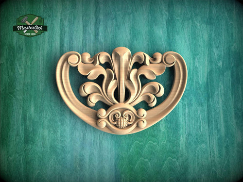 a decorative wooden carving on a green background.