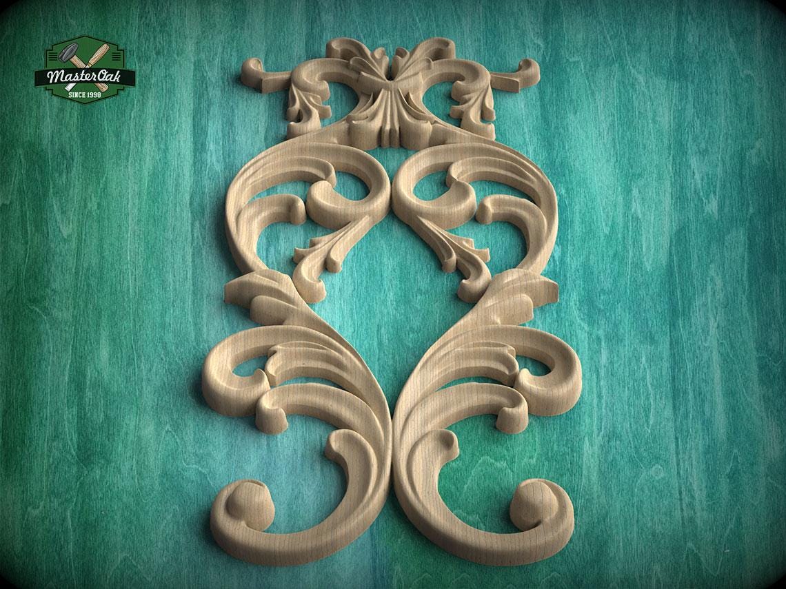 an ornate, carved wooden design with intricate scrollwork and floral patterns, set against a teal background.