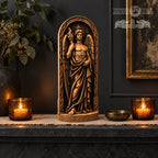 a statue of a winged figure holding a torch, surrounded by candles and a vase of flowers on a mantle.
