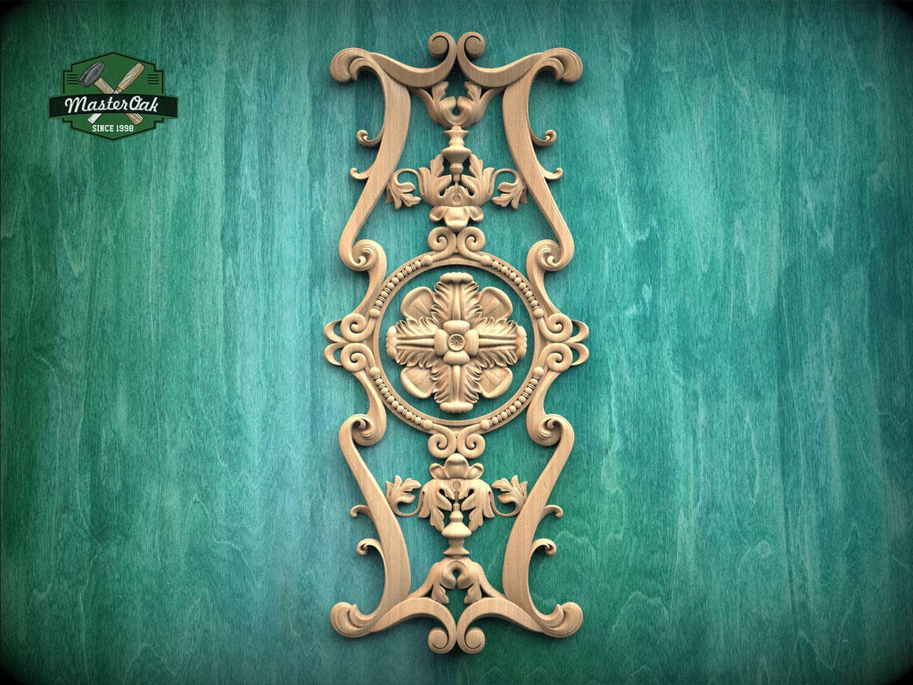 an ornate, carved wooden piece with intricate designs and patterns, mounted on a green wooden surface.