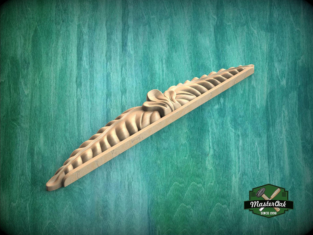 A wooden carving with a decorative design is displayed against a green background.