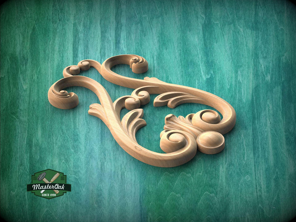 A wooden carving with intricate scrollwork and floral designs is displayed against a teal background.