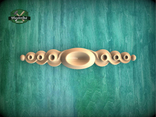 a group of knobs sitting on top of a green wall