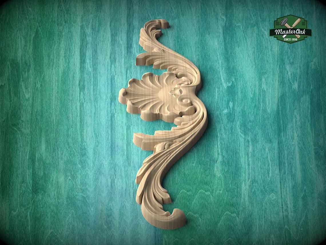A decorative wooden carving in the shape of a flower or leaf is displayed against a green textured background.