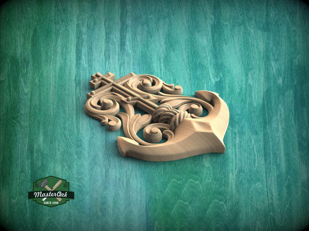 A wooden anchor with intricate carvings is displayed against a teal-colored background.