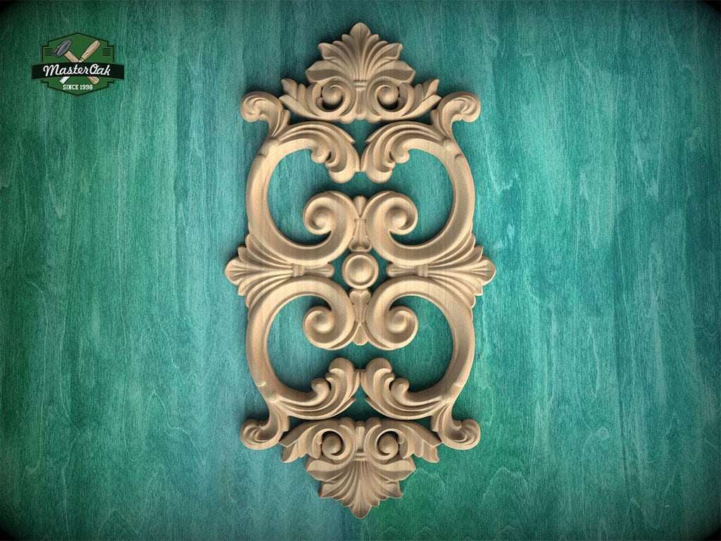 an ornate, carved wooden piece with intricate scrollwork and floral designs, set against a green wooden background.