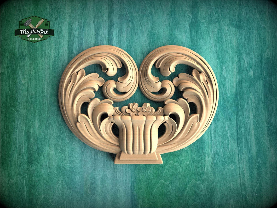 a decorative wooden carving of a heart shape, with intricate scrollwork and floral elements, set against a green background.