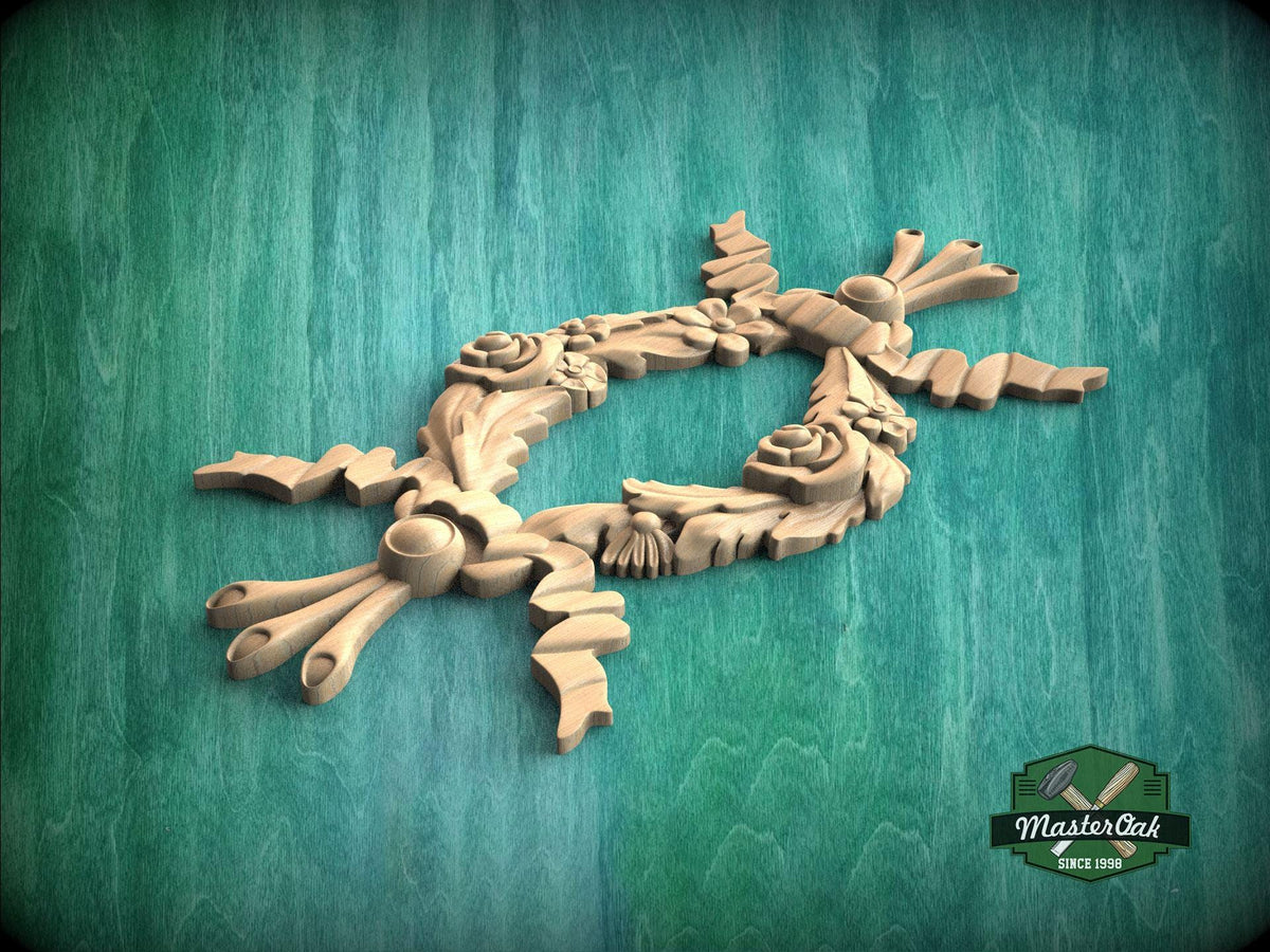 A wooden carving of a floral design is displayed against a green background.