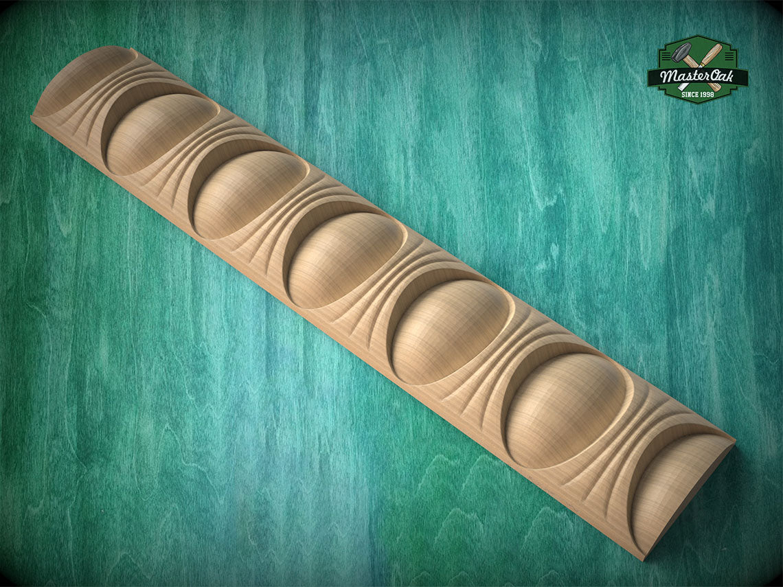 A wooden carving with a curved, organic shape resembling a series of circles or ovals, set against a green background.