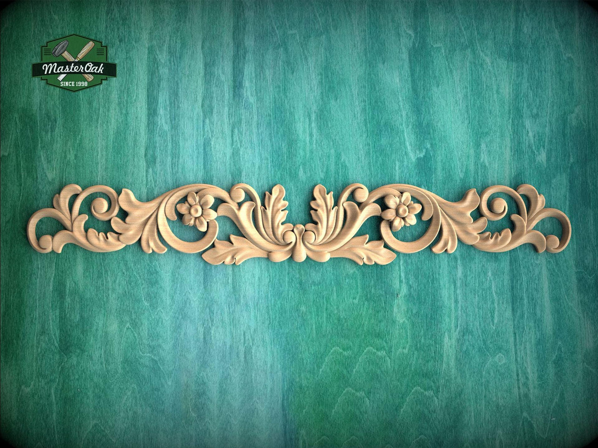 a decorative wooden carving on a green textured background.