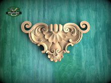 Load image into Gallery viewer, a decorative wooden carving on a green background.

