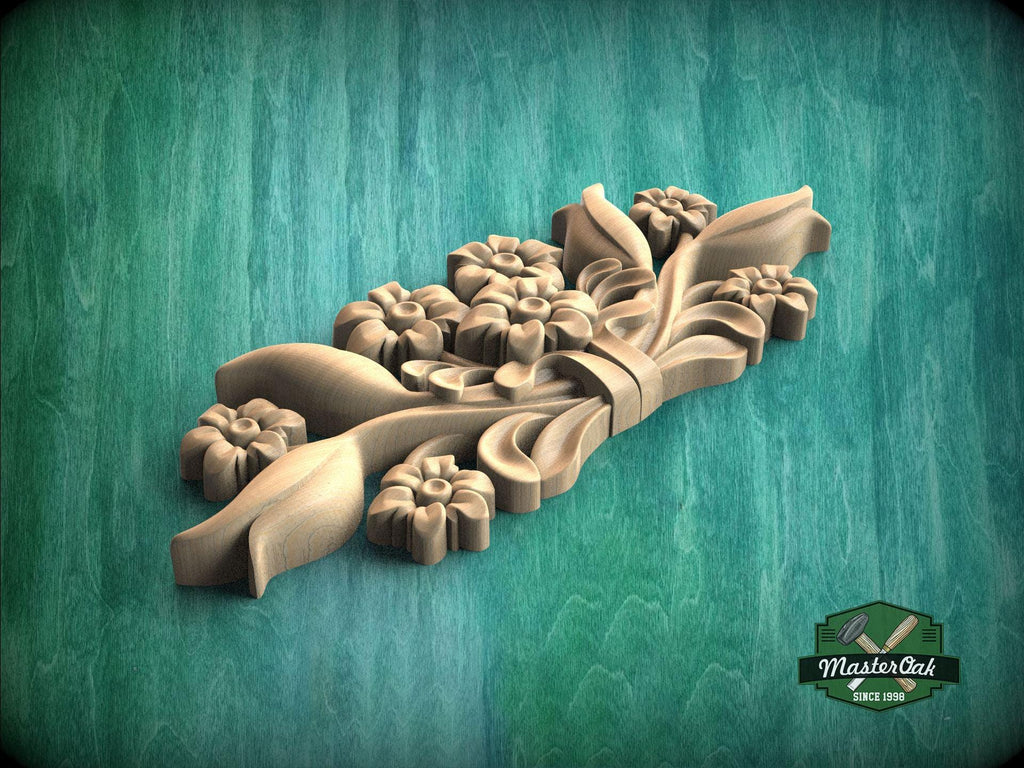 A wooden carving of a flower design is displayed against a green background.