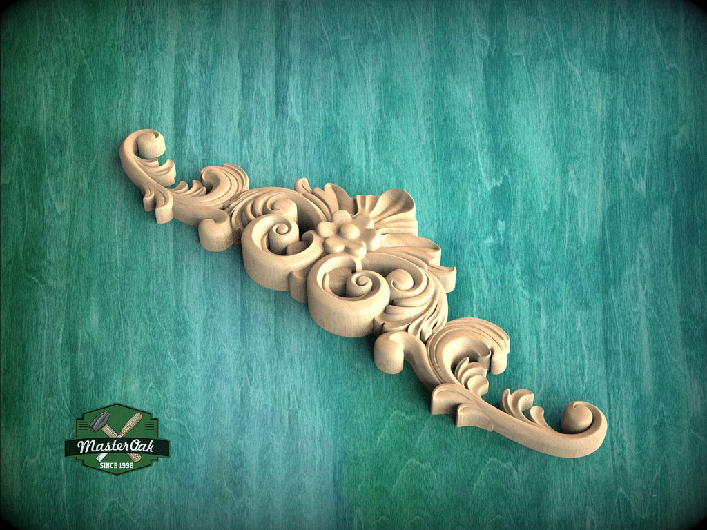 A decorative wooden carving with intricate scrollwork and floral elements is displayed against a green textured background.
