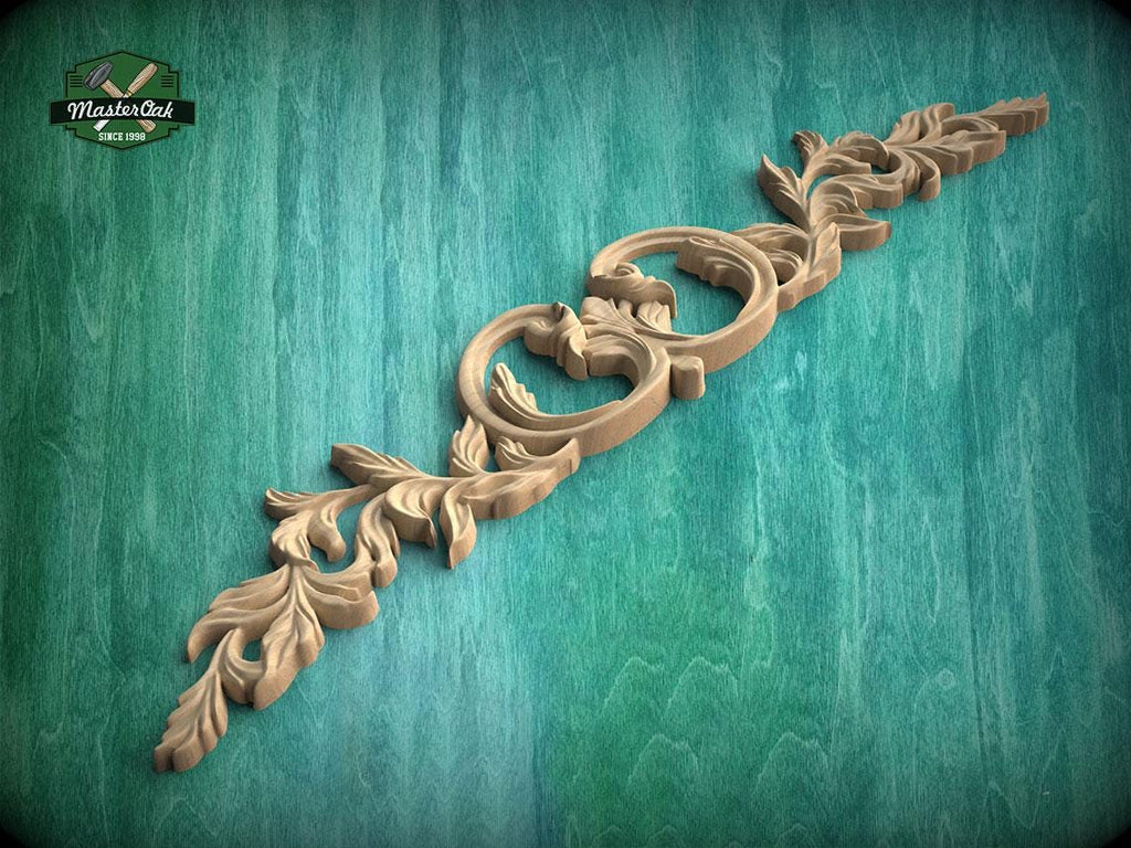 A decorative wooden carving with intricate floral patterns is displayed against a green background.