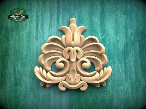 a decorative wooden carving on a green background.