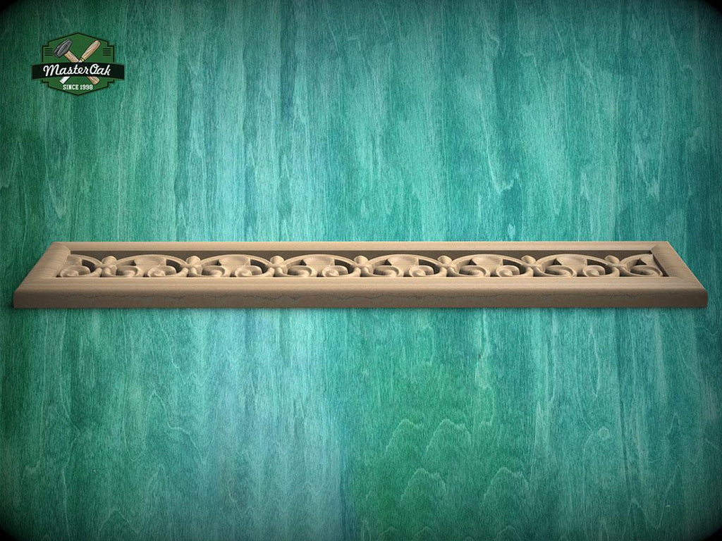 A decorative wooden frame with an intricate floral pattern is displayed against a textured green background.