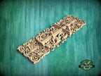 A decorative wooden carving with intricate scrollwork and floral patterns is displayed against a green background.