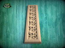 Load image into Gallery viewer, a decorative wooden panel with a carved design on a green background.
