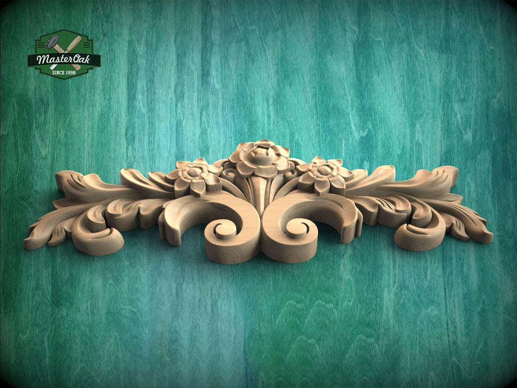 a wooden carving of flowers and leaves on a green background