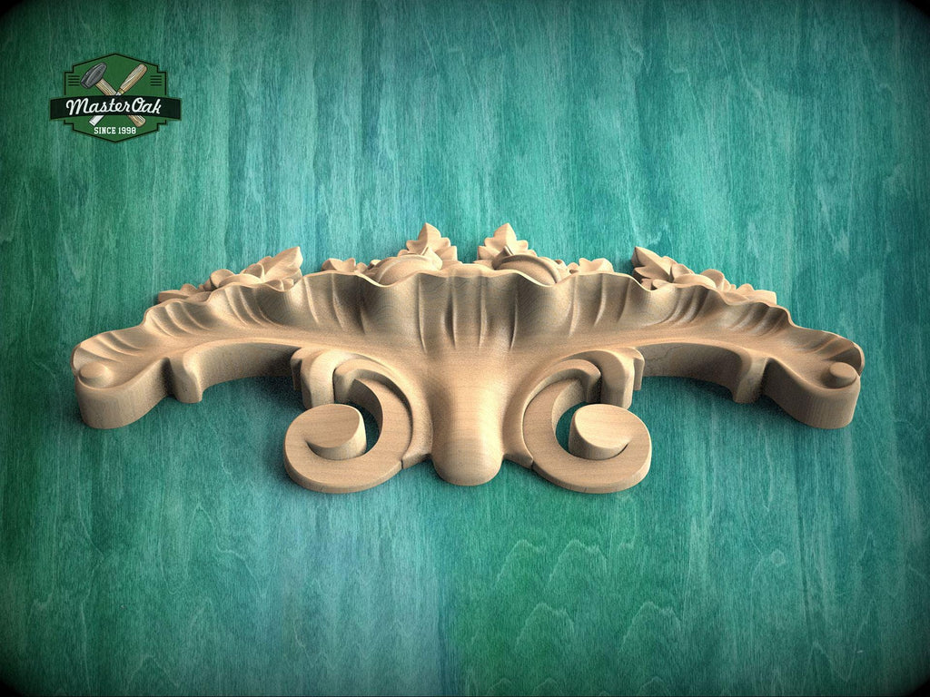A wooden carving with intricate scrollwork is displayed against a green background.