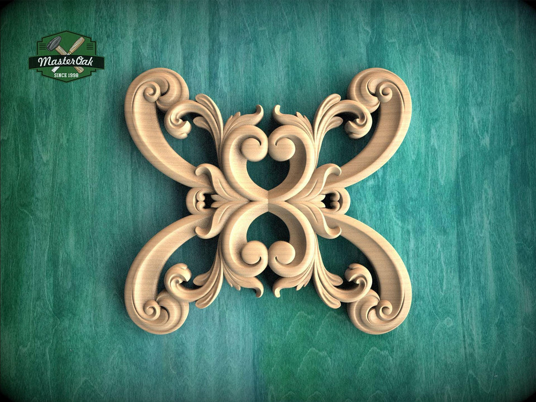a decorative wooden carving with an intricate, symmetrical design on a green background.