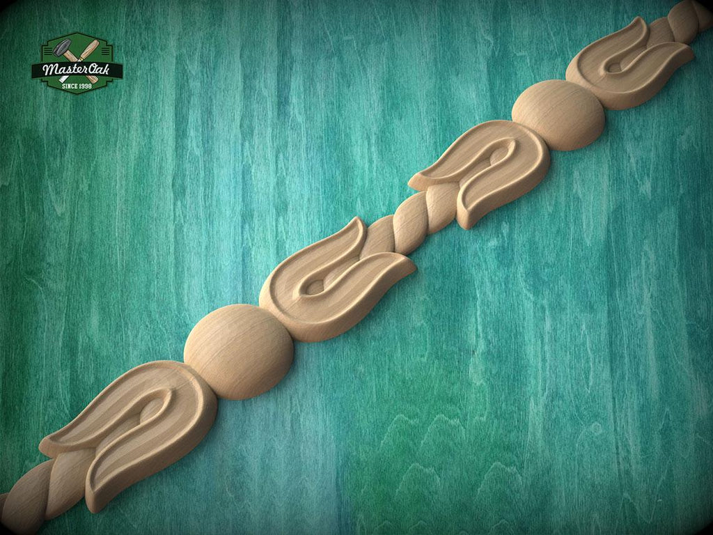 A decorative wooden carving with a floral pattern is displayed against a teal-colored background.