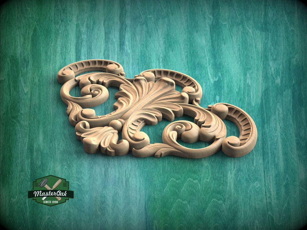 a wooden carving of an ornate design on a green background