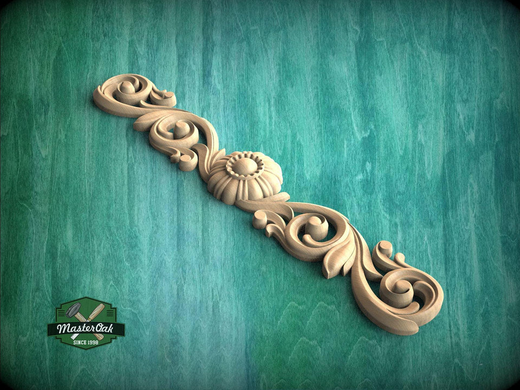 a wood carving of a decorative design on a green background