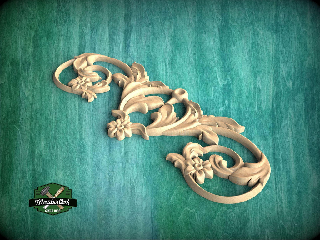 A decorative wooden carving with intricate floral and scroll designs is displayed against a green textured background.