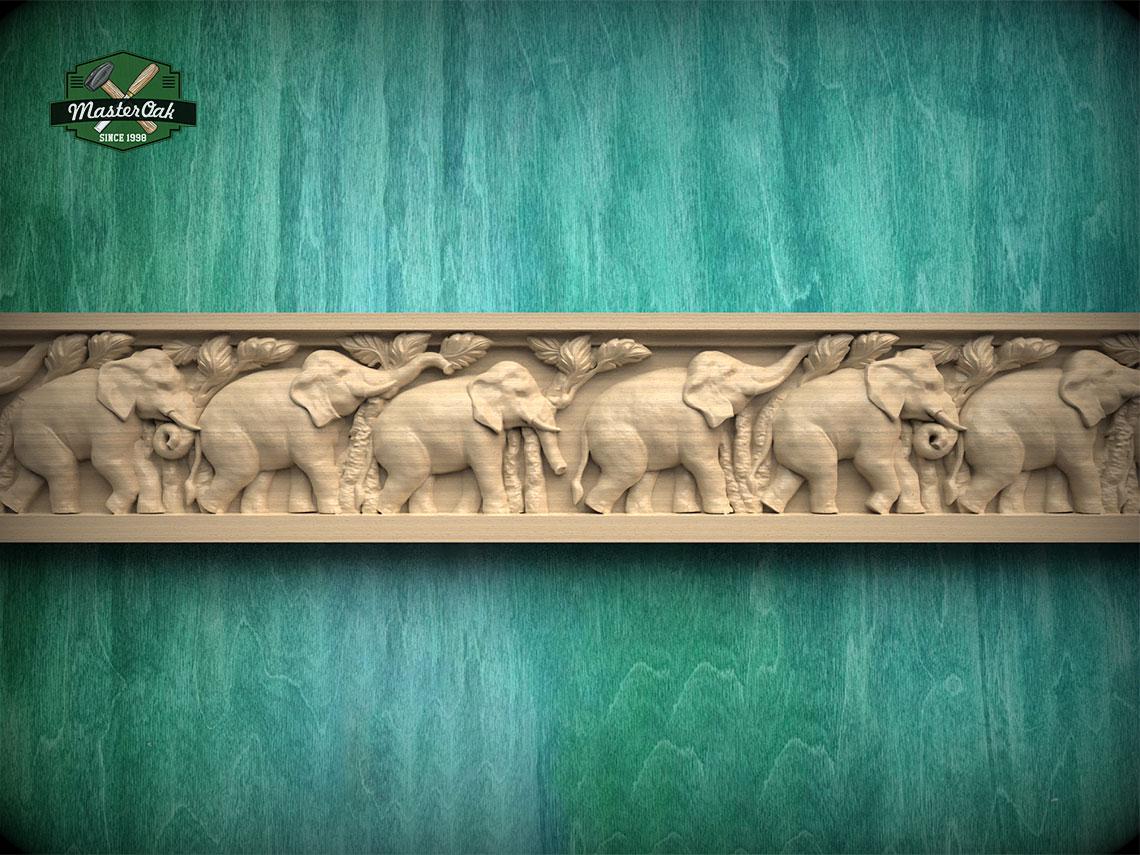 a carved wooden elephant design on a green background.