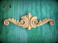 a wooden door handle with a green background