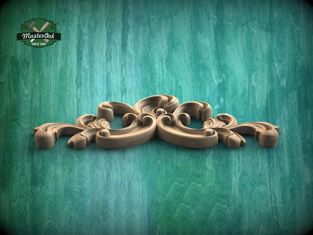 A decorative wooden carving with intricate scrollwork is displayed against a textured green background.