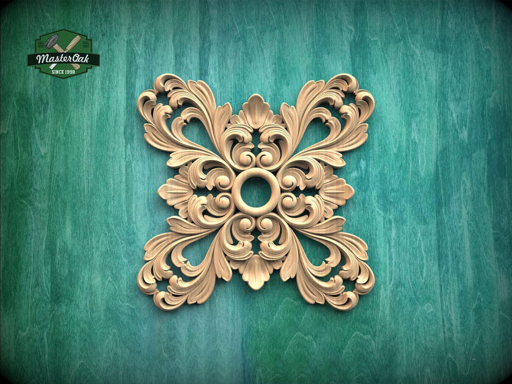 a decorative wooden piece with an intricate, symmetrical design on a green background.