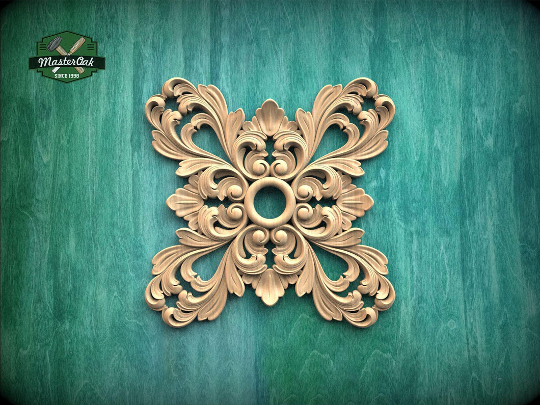 a decorative wooden piece with an intricate, symmetrical design on a green background.