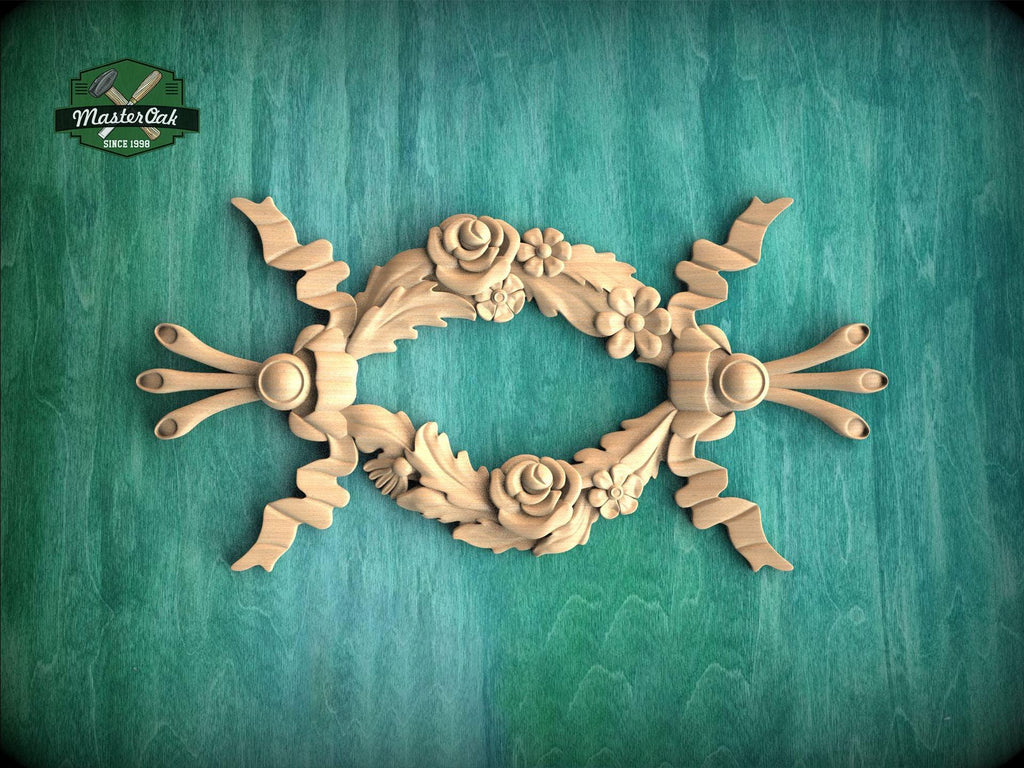 A decorative wooden frame with intricate floral designs, including roses and leaves, is displayed against a green background.