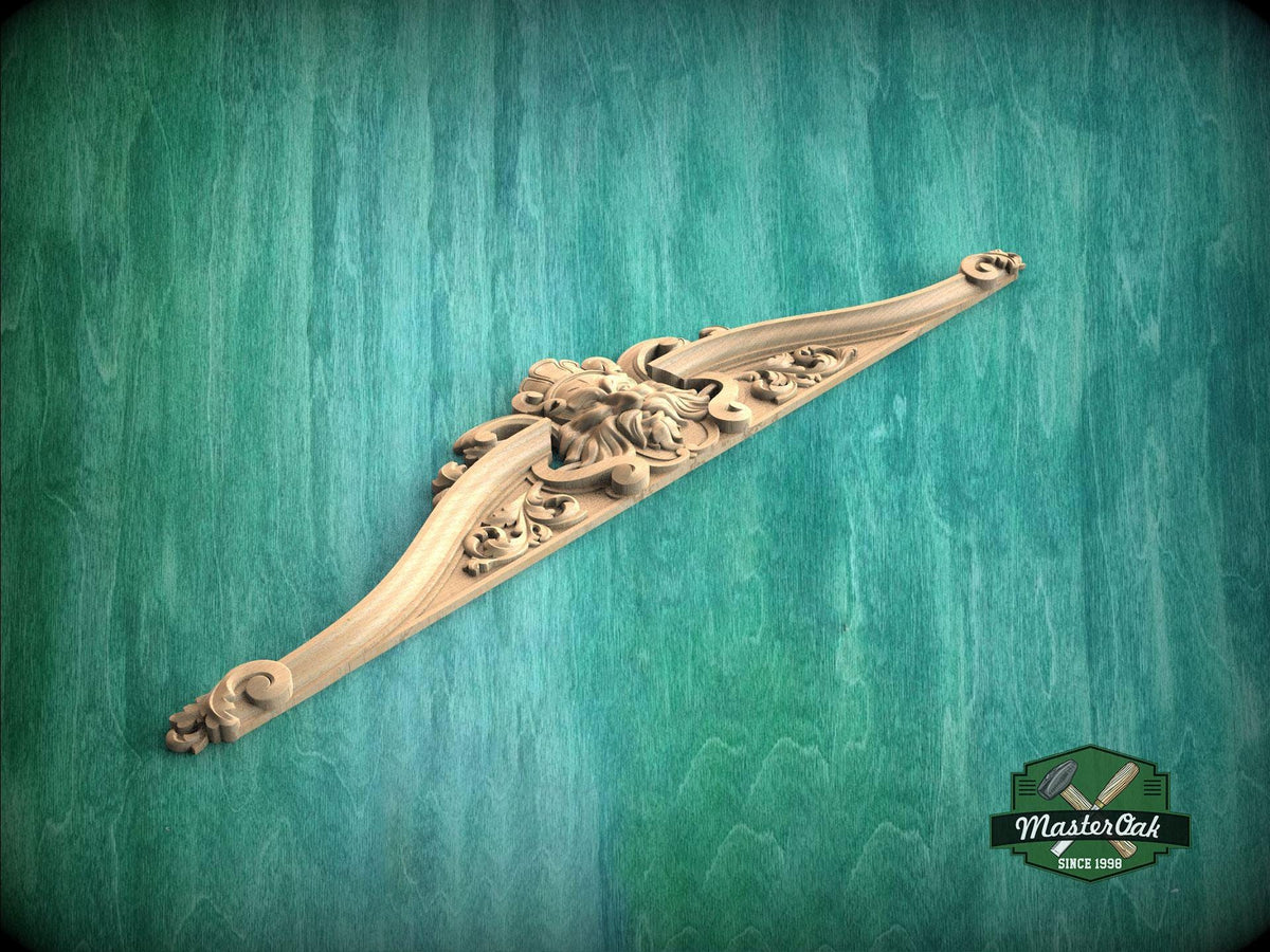 A decorative wooden carving with intricate floral and scrollwork designs is displayed against a green background.