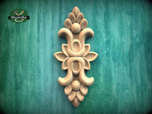 Load image into Gallery viewer, a decorative wooden carving on a green background.
