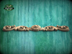 a wood carving pattern on a green background