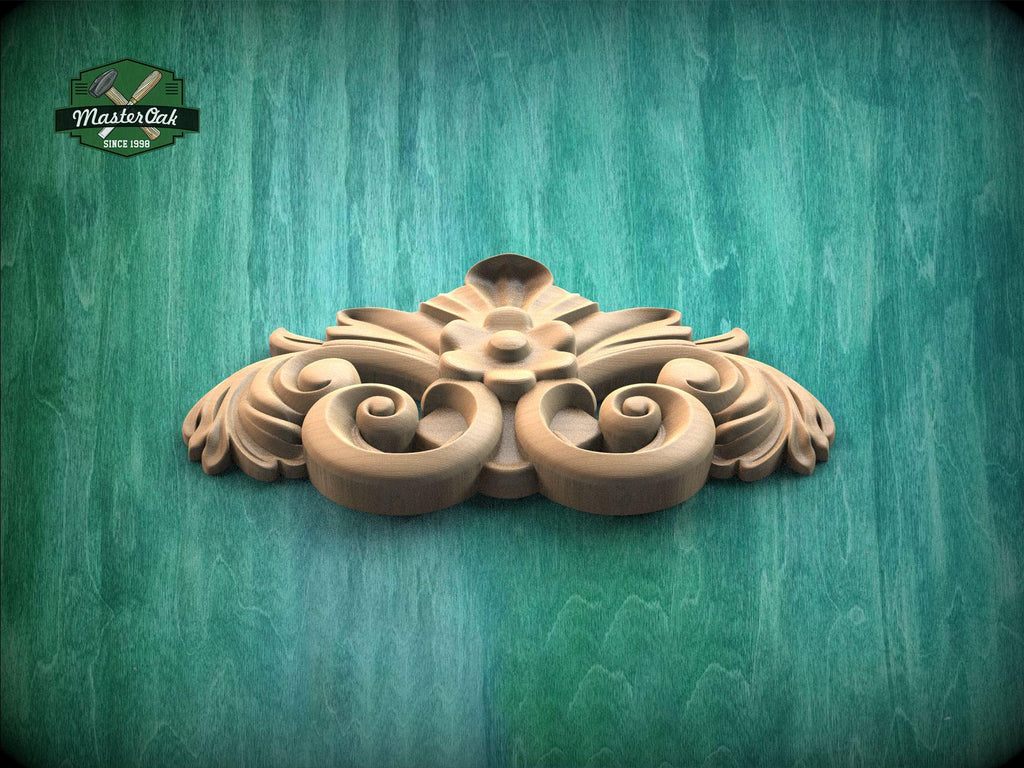 A decorative wooden carving with intricate scrollwork is displayed against a green textured background.