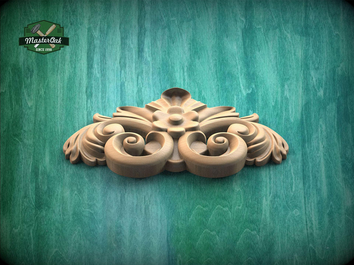 A decorative wooden carving with intricate scrollwork is displayed against a green textured background.