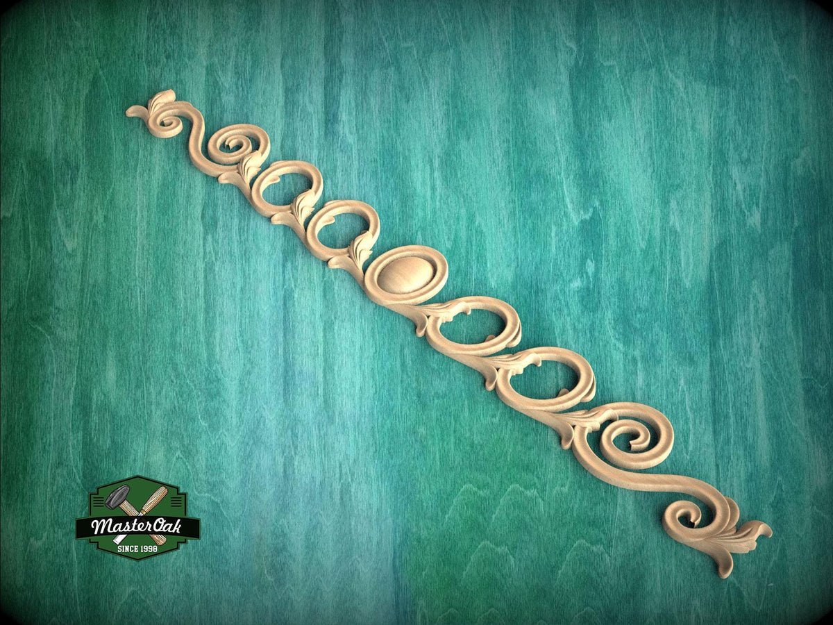 a decorative scrollwork piece with a green background.