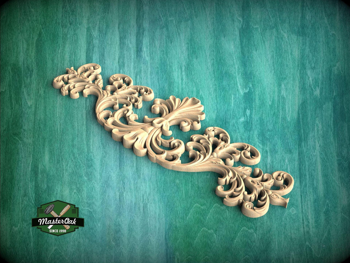 A decorative wooden carving with intricate scrollwork is displayed against a teal background.