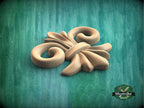 a wooden object sitting on top of a green surface