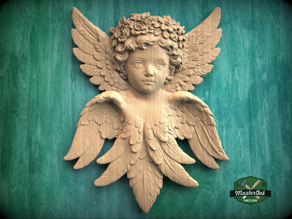 Carved wooden cherub wall onlay with detailed wings and floral crown, shown in natural wood finish against a textured background.