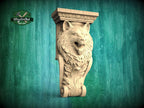 A carved wooden wolf head is displayed against a green background, with a logo for Master Oak visible in the top left corner.