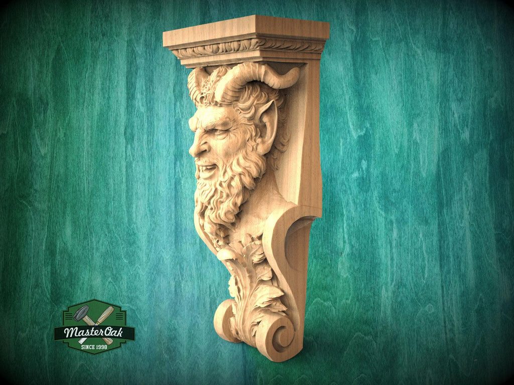A carved wooden sculpture of a face with horns and a beard, mounted on a green wooden surface.