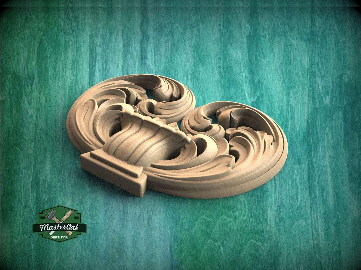 A carved wooden piece with an intricate, swirling design sits on a green wooden surface.